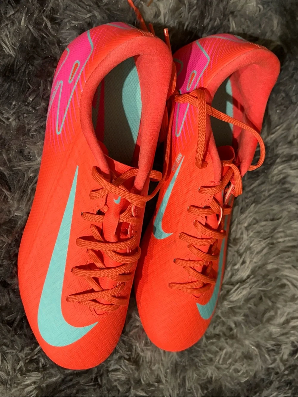 Nike Women's Bright Red Athletic Cleats with Light Blue Swoosh